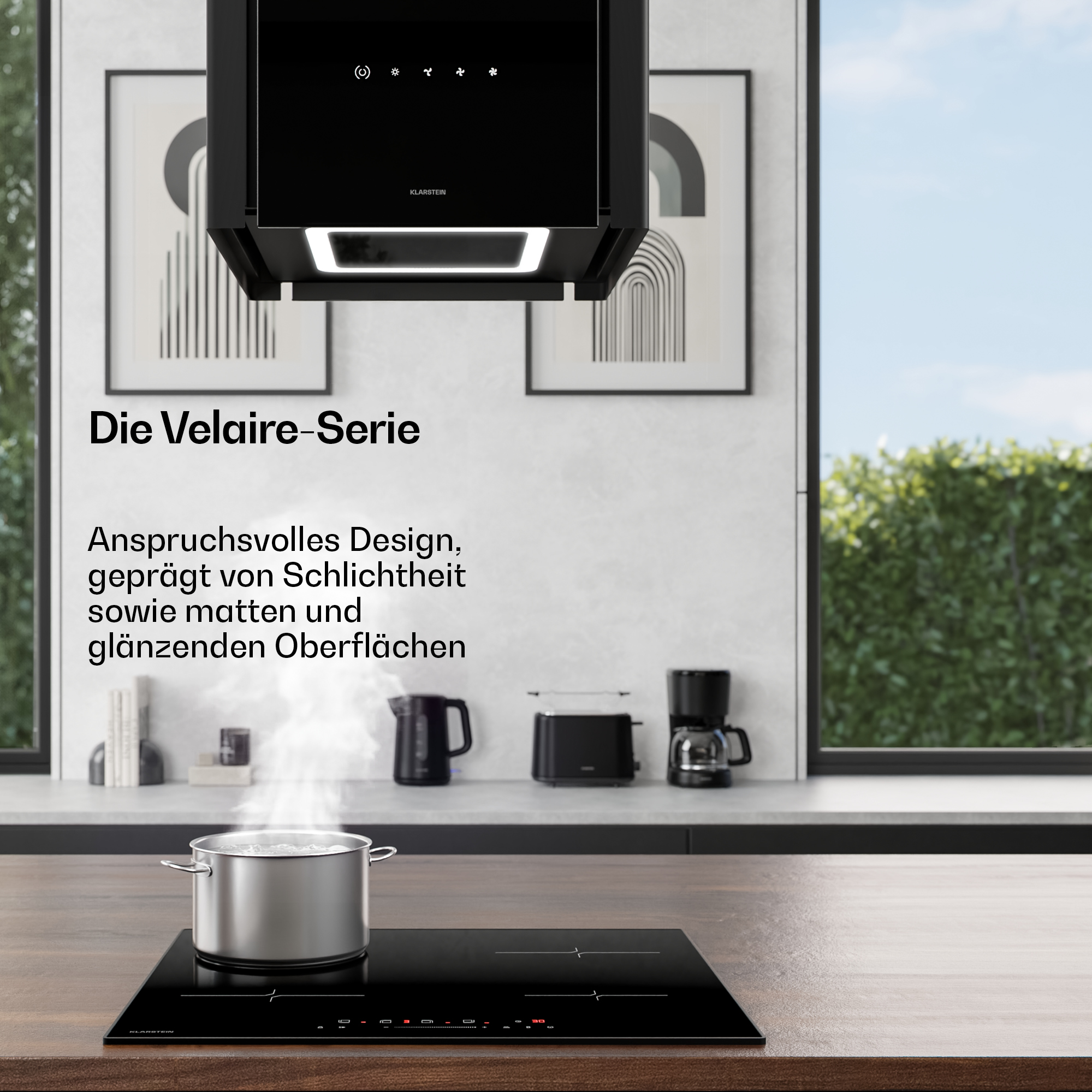 Ein moderner Küchenblock mit Dunstabzugshaube, Kochfeld, Toaster und Kaffeemaschine.