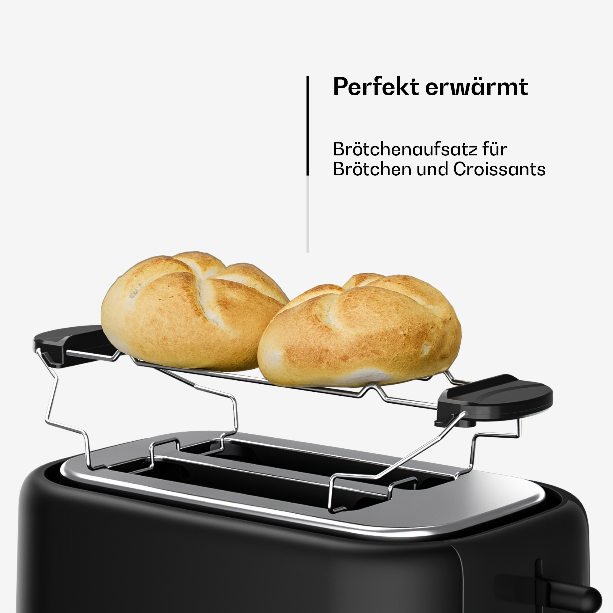 Ein schwarzer Toaster mit einem Brötchenaufsatz, auf dem zwei goldbraune Brötchen liegen.