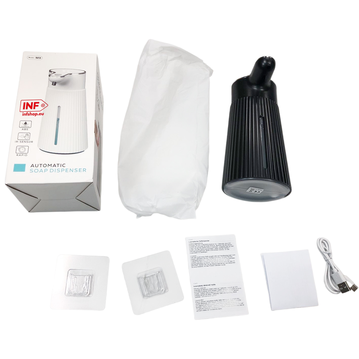 Verpackter weißer Seifenspender, schwarzer Spender, Anleitung, Wandhalterungen, USB-Kabel.