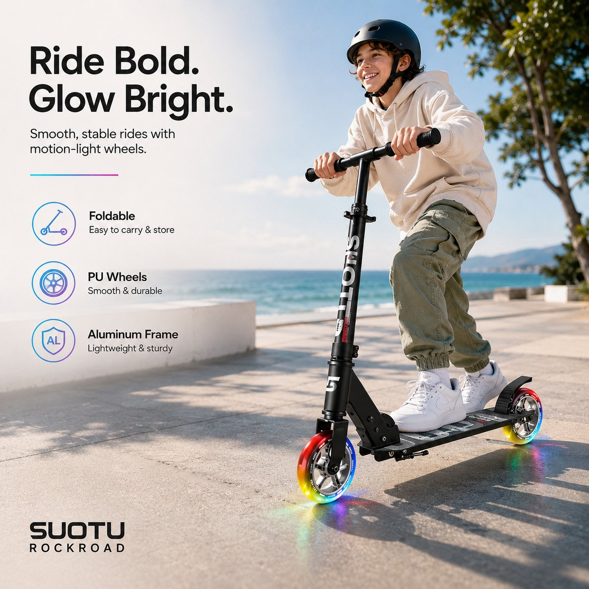 A boy rides a black scooter with light-up wheels by the sea.