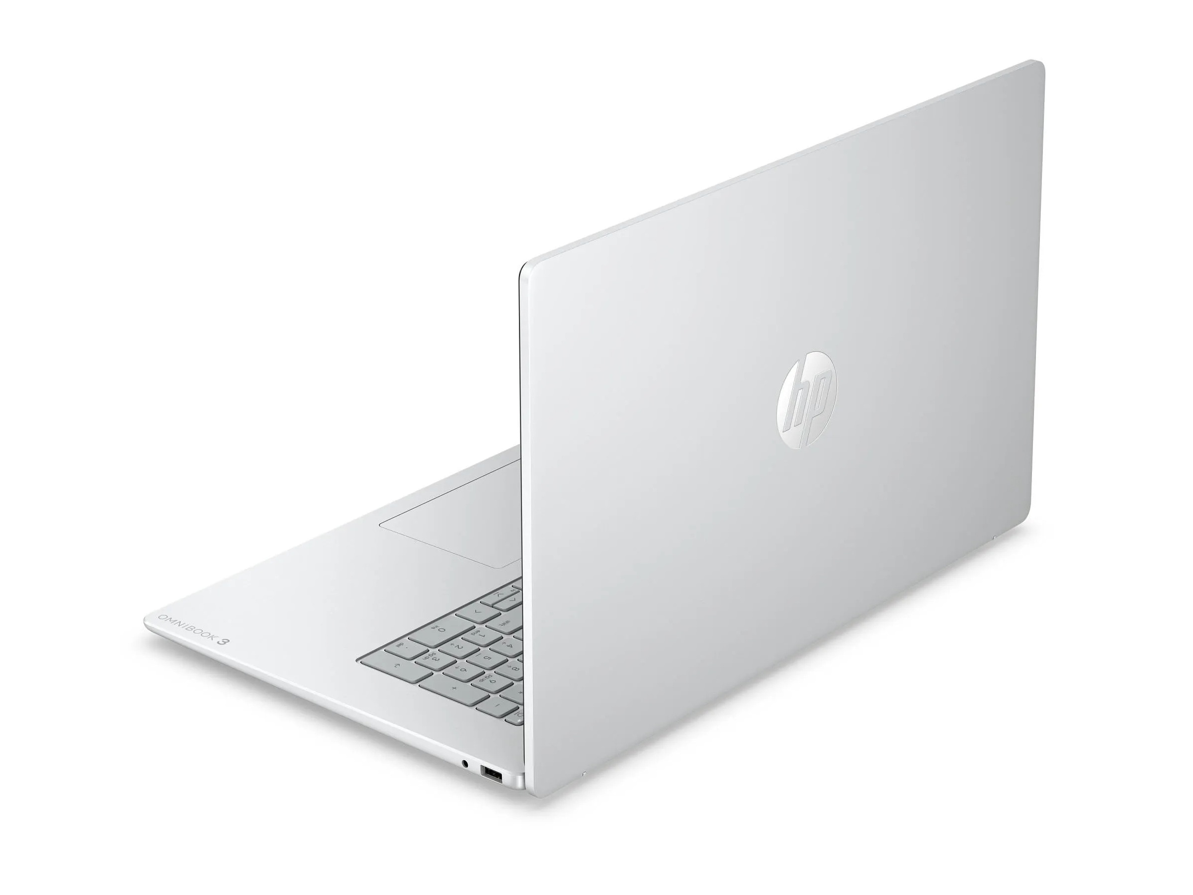 Ein weißer HP Laptop mit beleuchteter Tastatur und Touchpad.