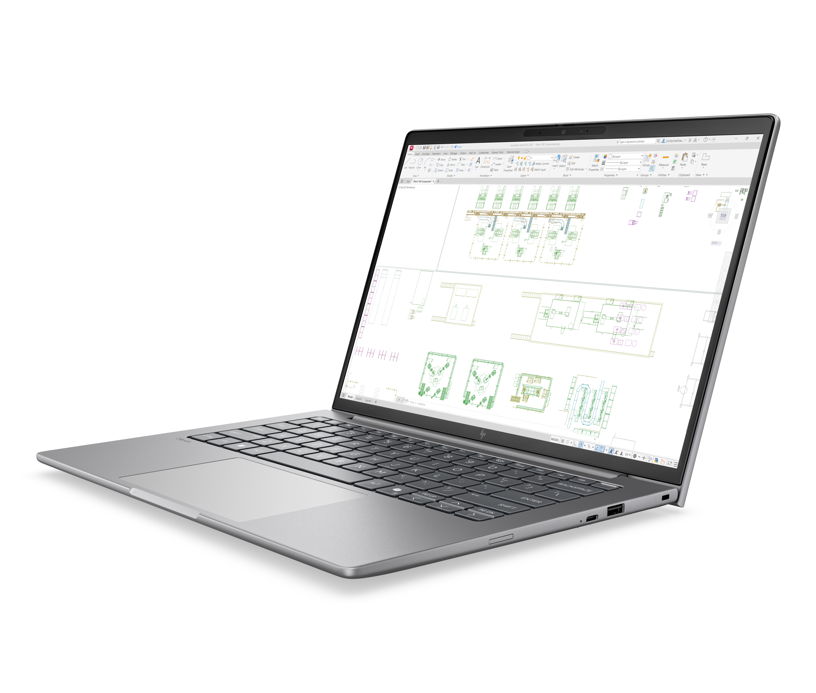 Un laptop argento con schermo aperto, che mostra un disegno tecnico.