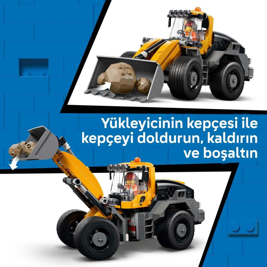 Kamyonun kepçesi taşlarla dolu ve boş gösteriliyor.