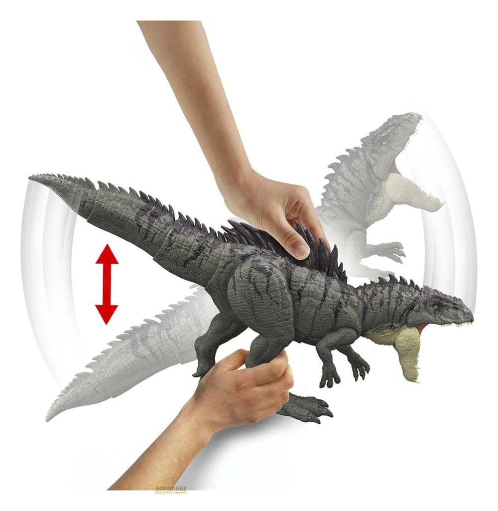 Juguete de dinosaurio gris con cola móvil sostenido por manos.