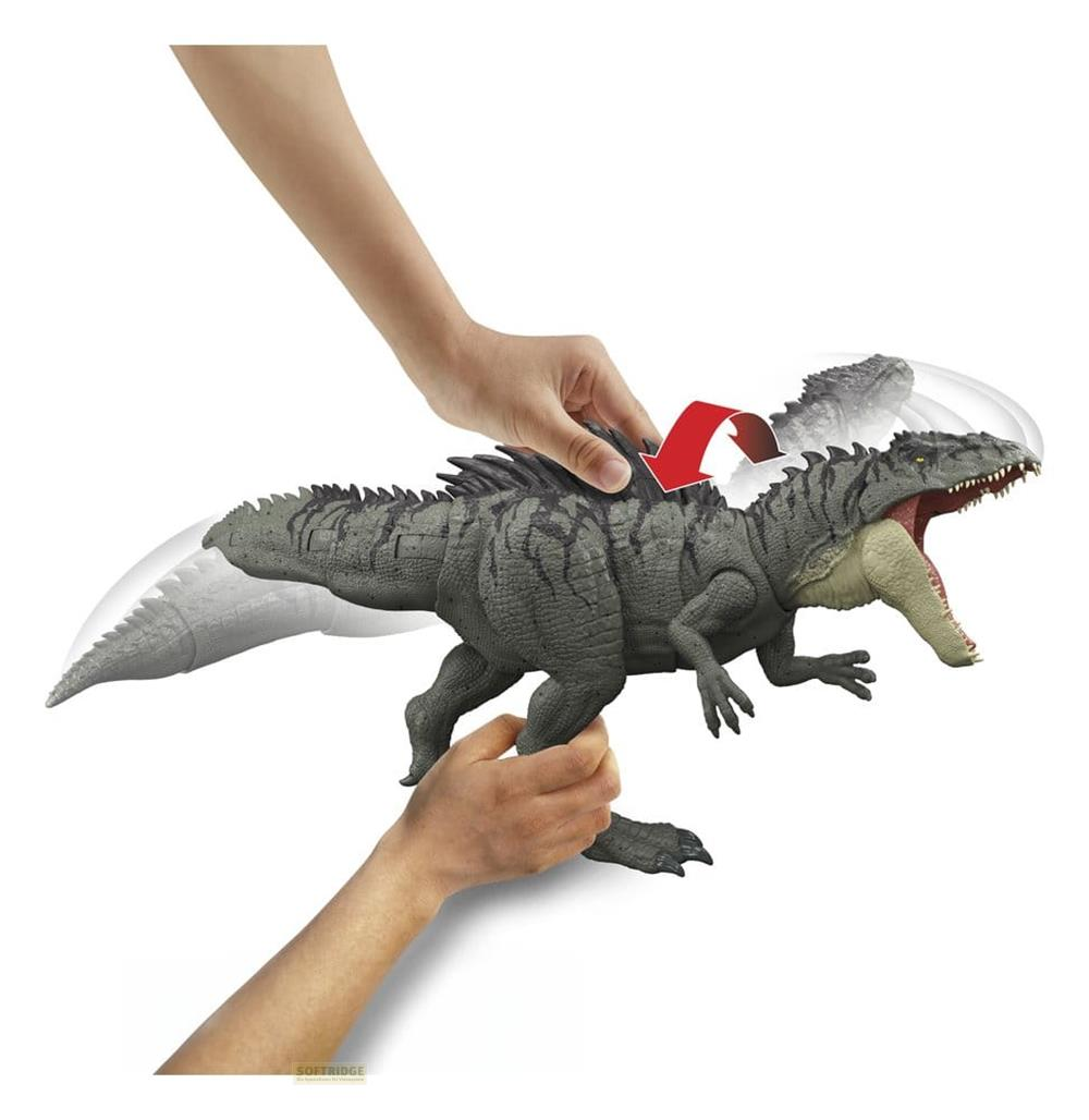 Figura de dinosaurio gris con boca abierta, sostenida y movida por manos.