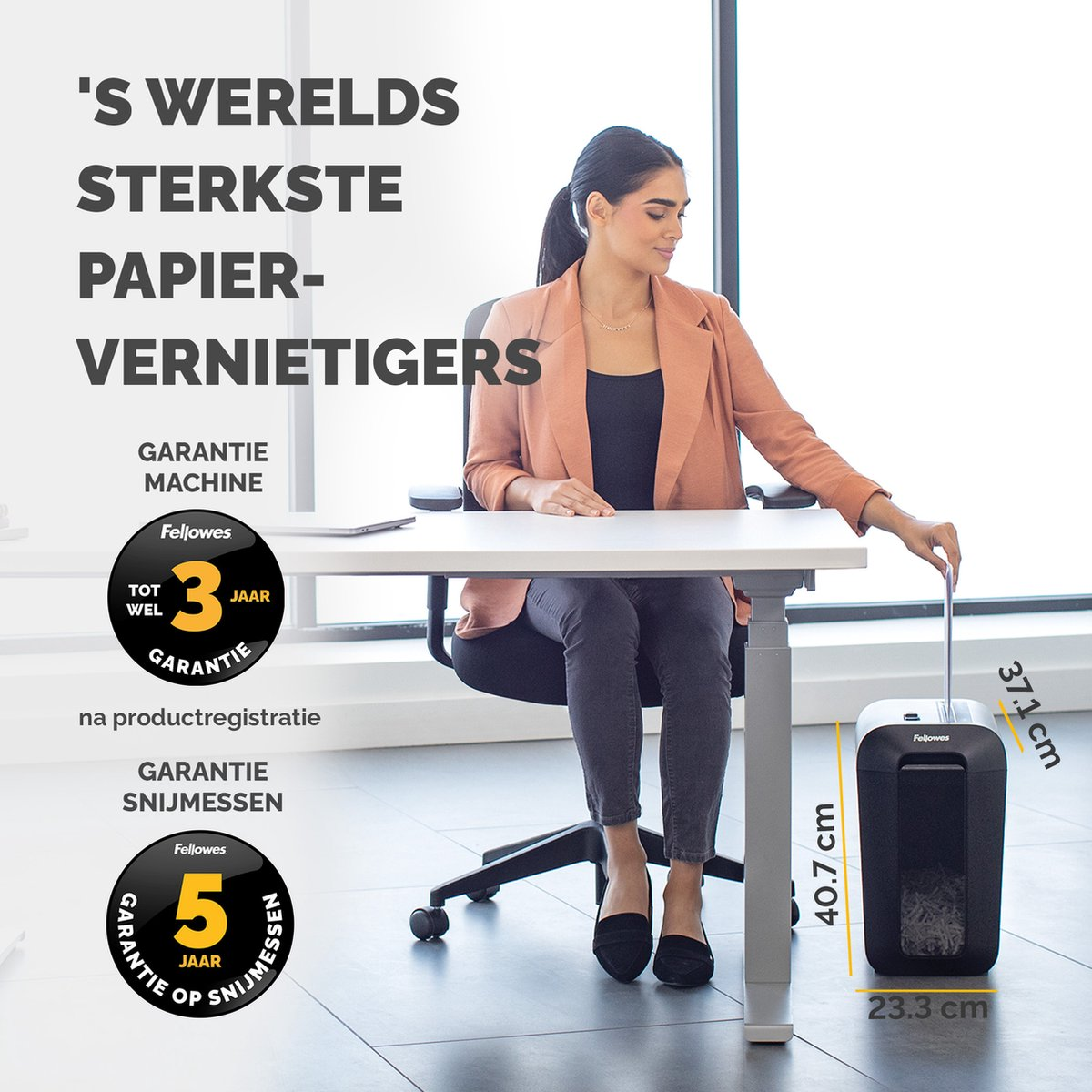 A woman sits at a desk, feeding paper into a shredder. Text highlights 3 and 5 year warranties.