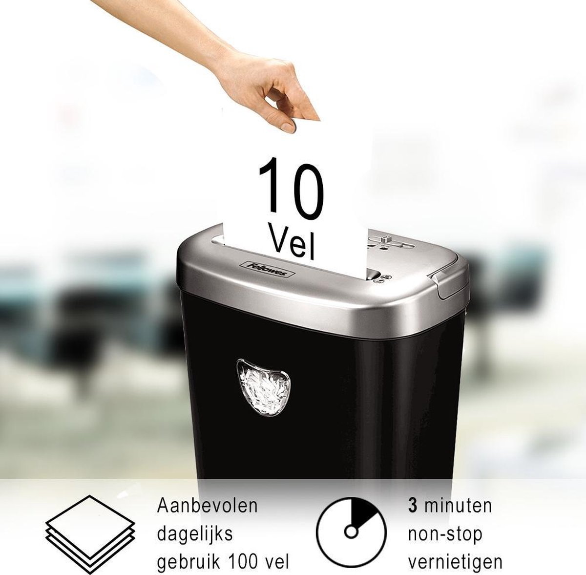 Ręka wkłada papier do niszczarki. Na papierze widnieje napis "10 Vel".