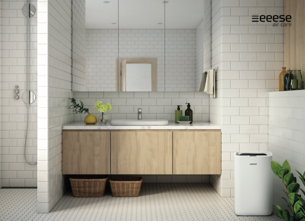 Modern bathroom with shower, vanity, mirror, and air purifier.