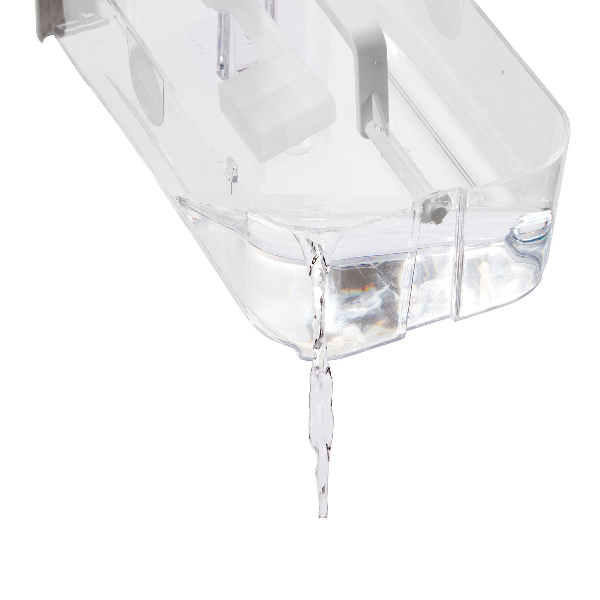 Clear container with water dripping. Shows a white ice cube mold.
