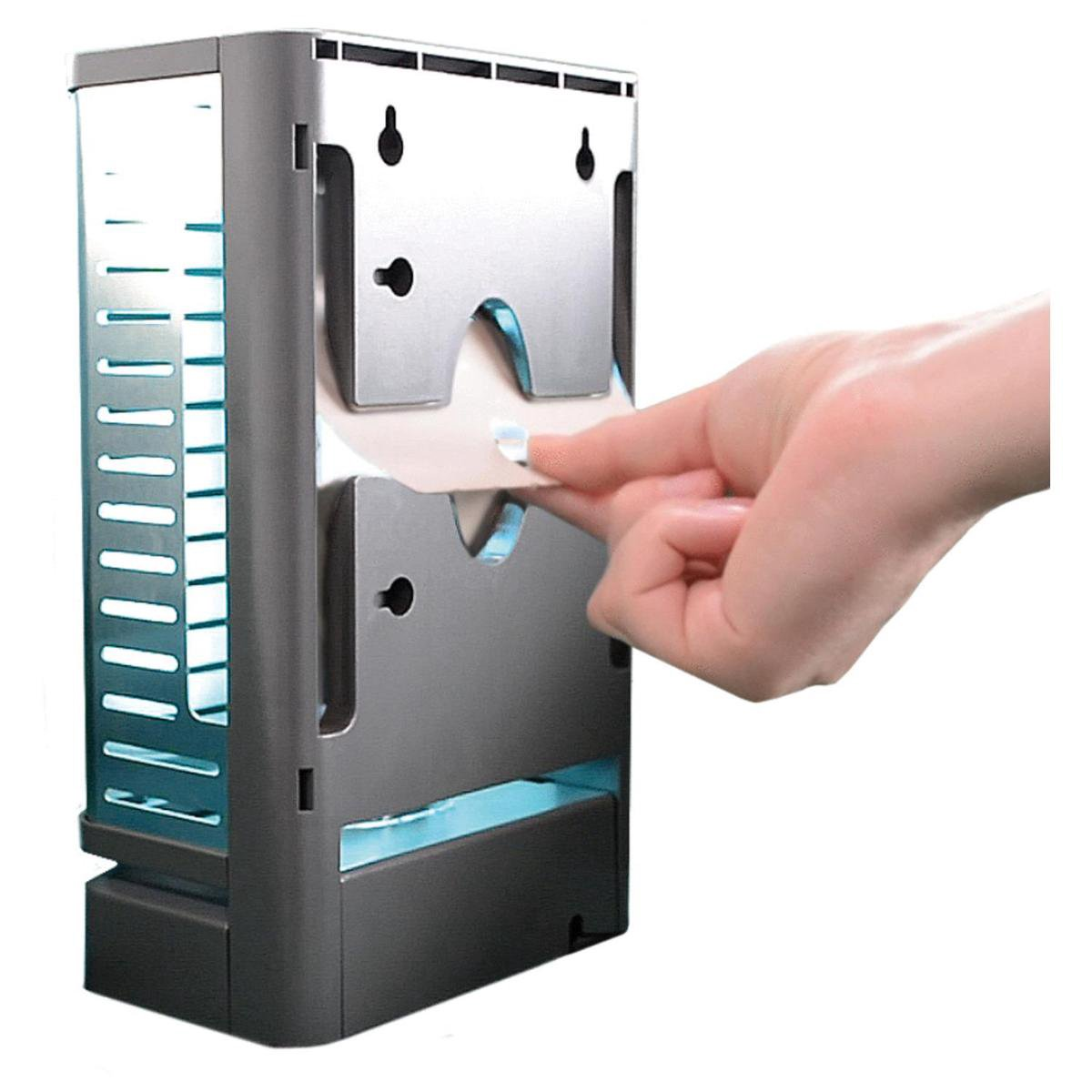 A hand pulls a sheet from a silver dispenser with blue lighting.