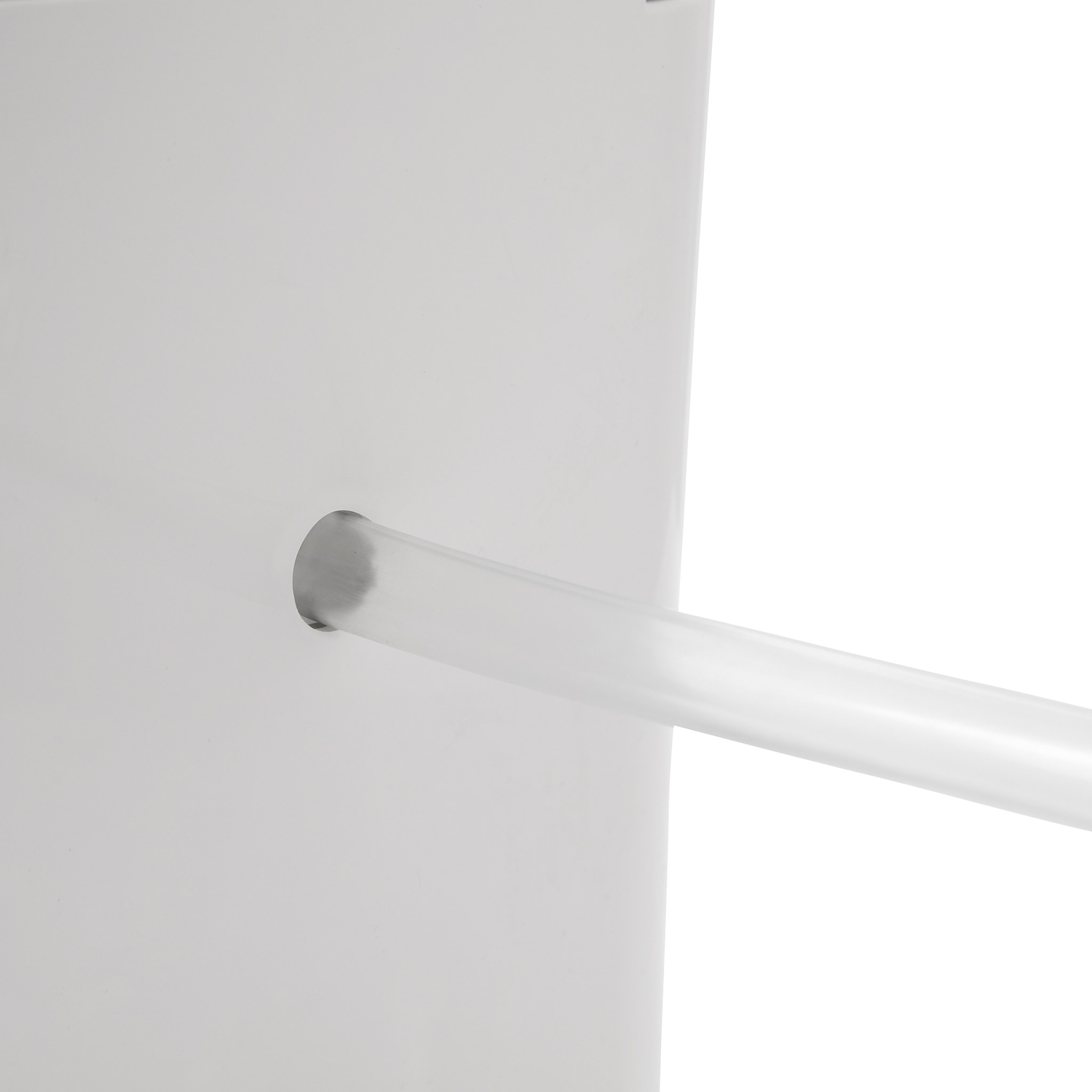 A white container with a clear tube protruding from its side.