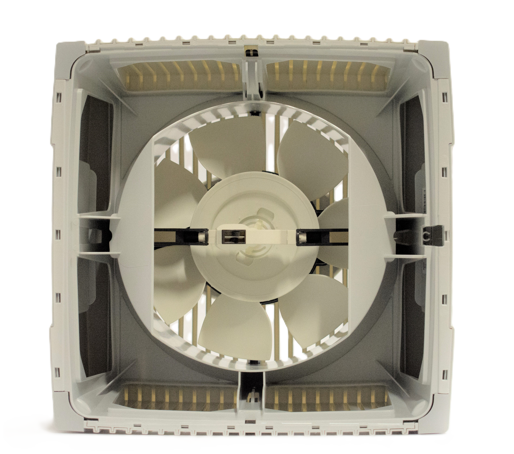 A white four-bladed fan within a white housing, set against a black background.