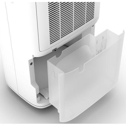 A white dehumidifier with its transparent water tank drawer pulled out.