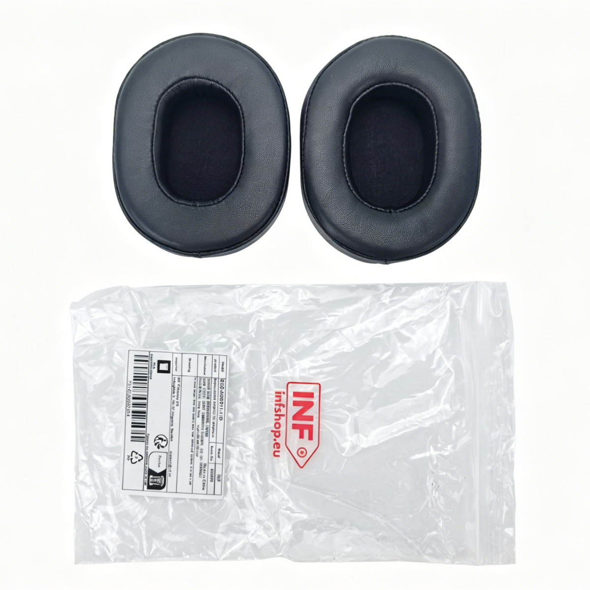 Two black ear pads rest above a clear plastic bag with a label.