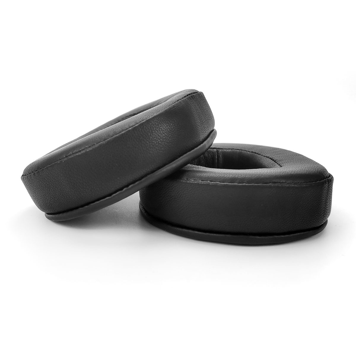 Two black headphone ear pads are on a white background.
