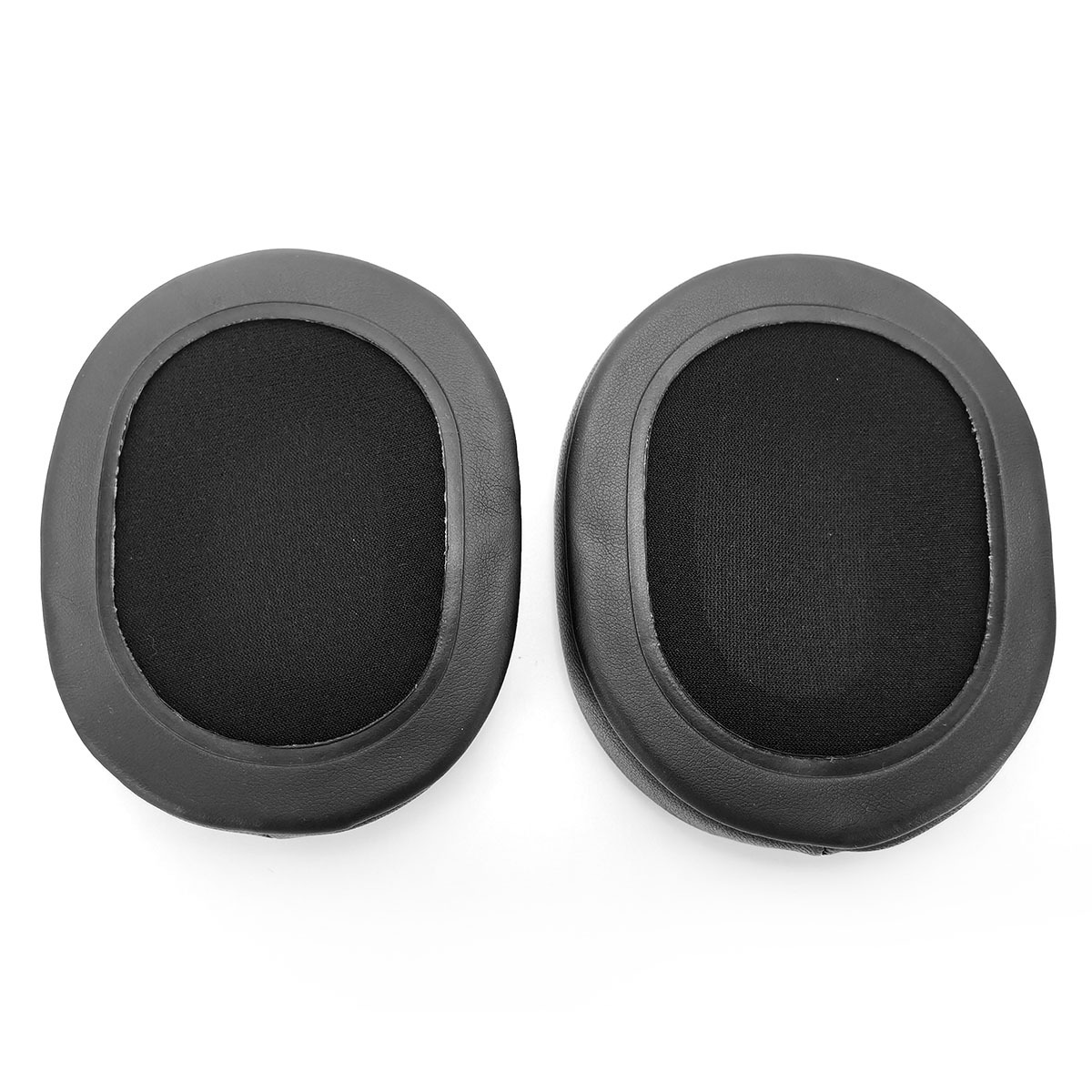Two black ear pads are lying side by side on a white background.