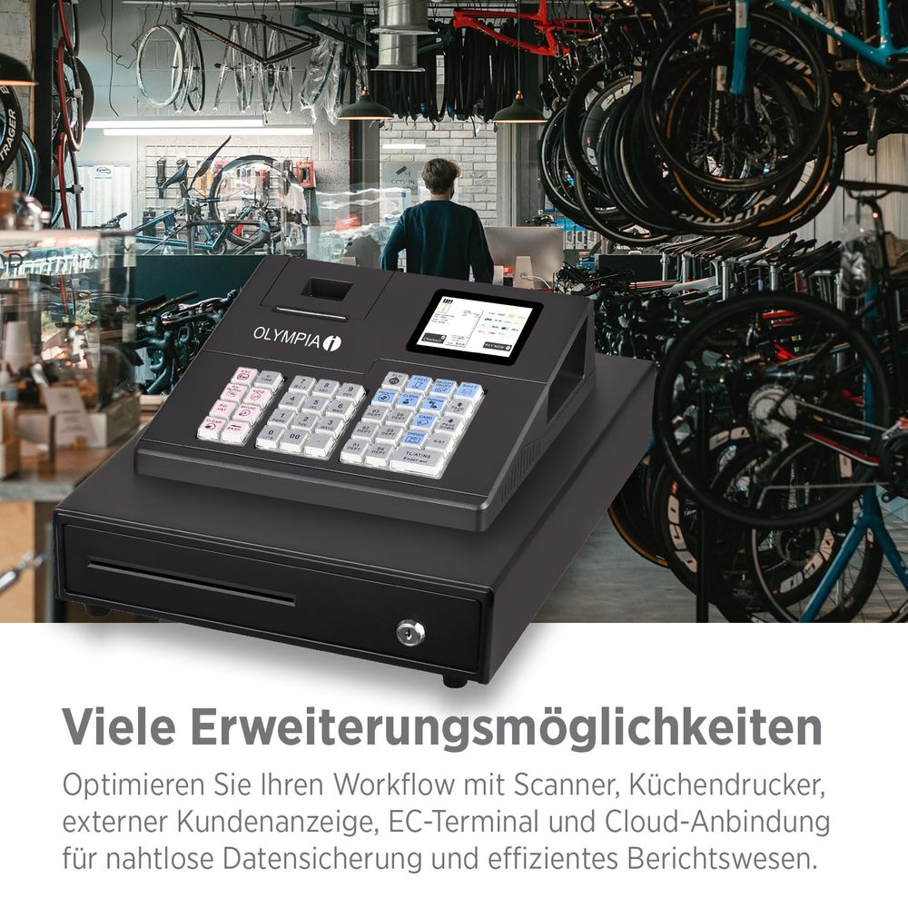 Kasse mit Tastatur und Bildschirm, im Hintergrund ein Fahrradladen.