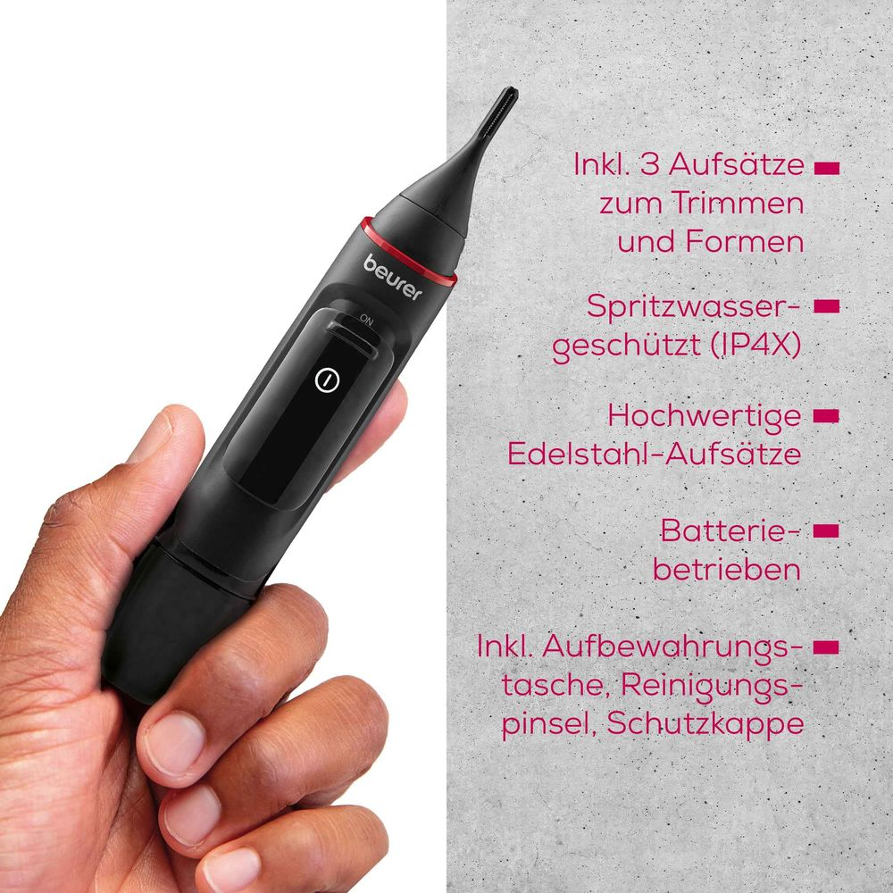 Eine Hand hält einen schwarzen Beurer Nasenhaartrimmer mit Zubehörinfos.