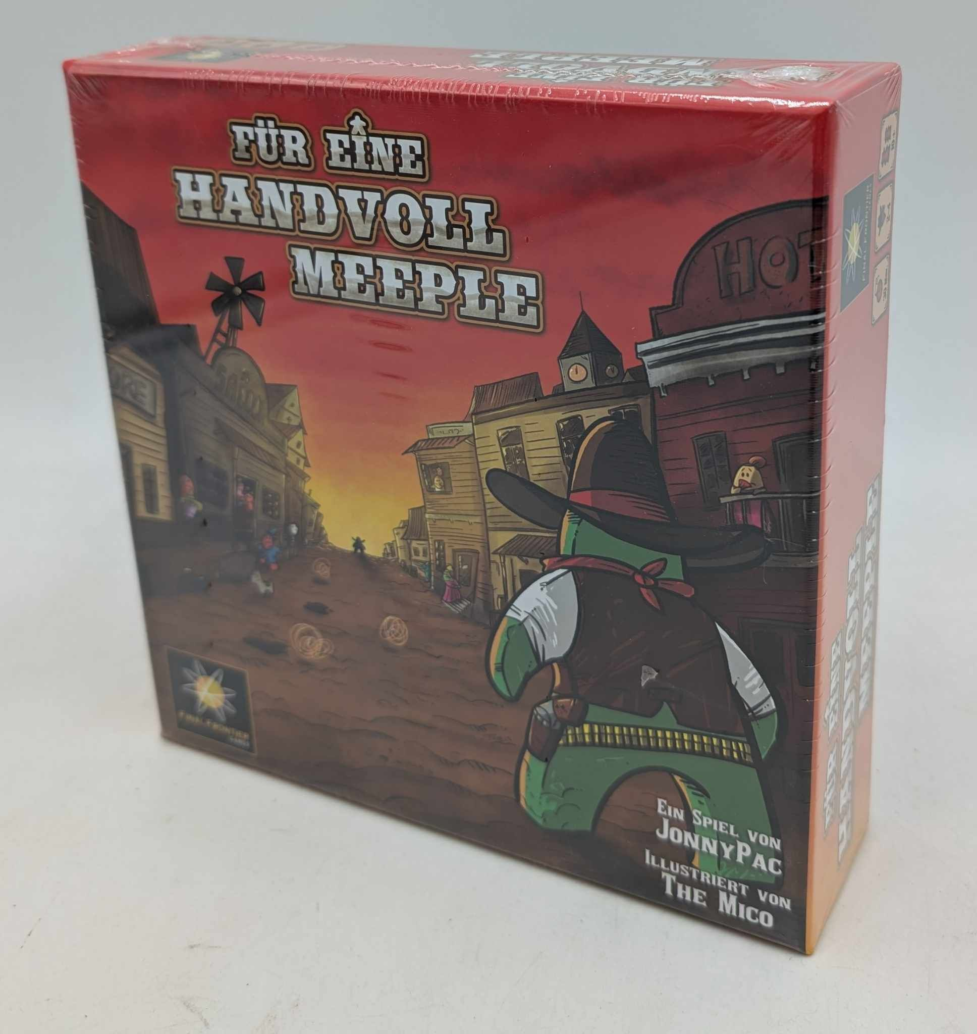 Brettspielverpackung mit Western-Thema, ein grüner Charakter mit Hut und Banditen-Look.