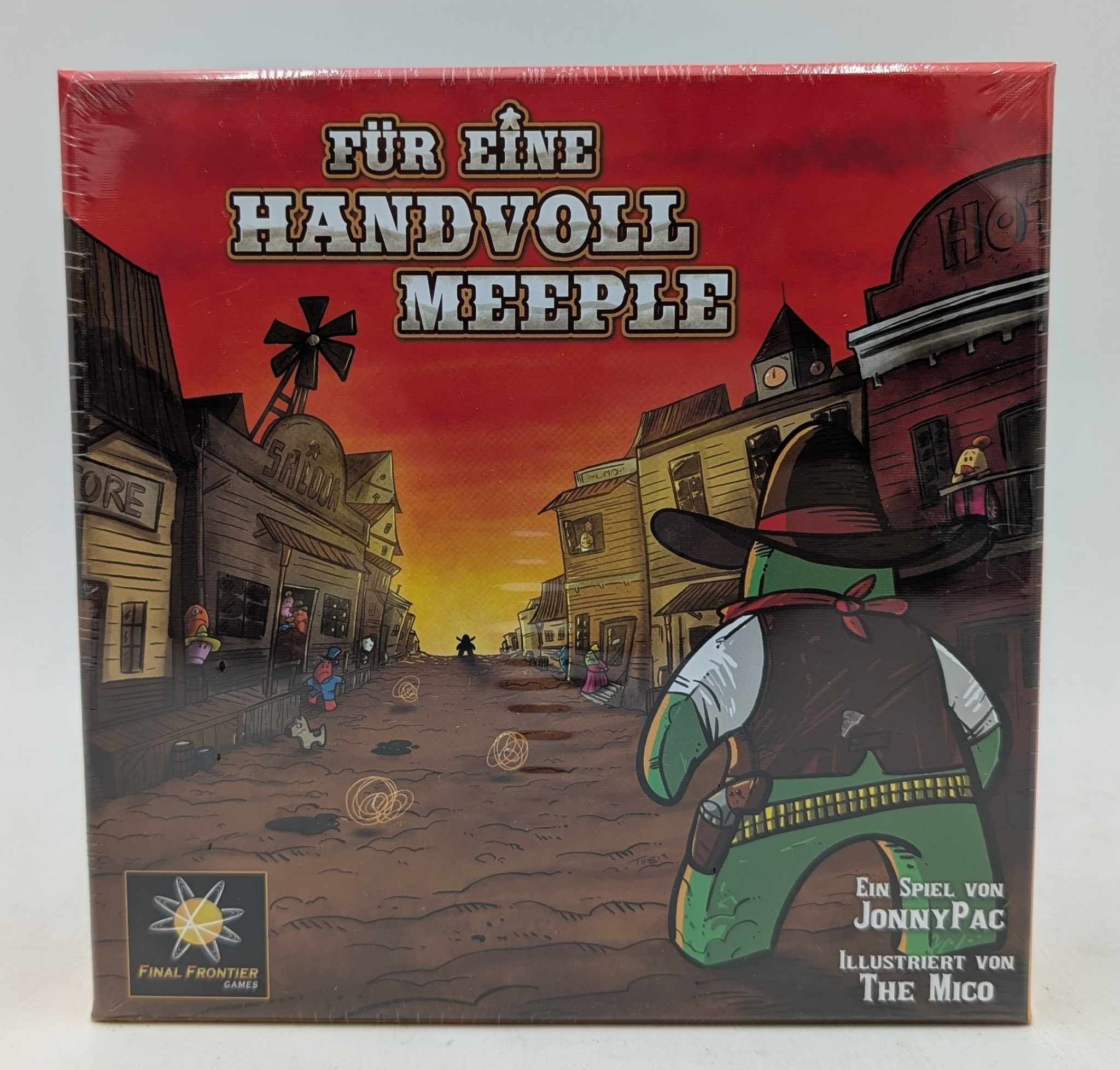 Brettspielbox mit Westernstadt-Szene und einem grünen Charakter mit Hut.