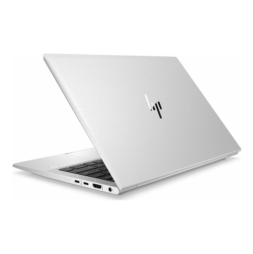 Ein silberner HP Laptop ist geöffnet und zeigt die Tastatur und Anschlüsse.