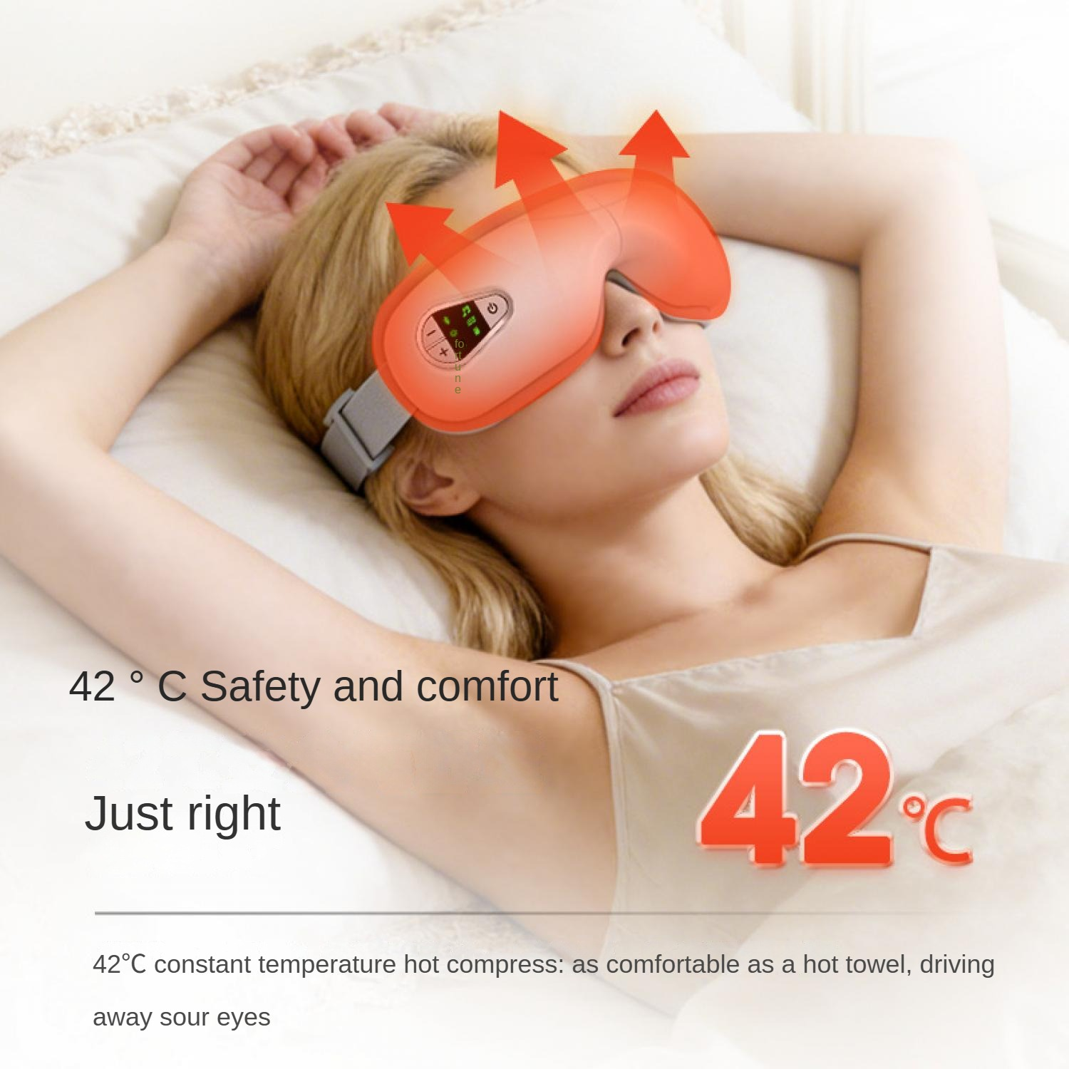 Frau mit Augenmaske und Heizfunktion, liegt im Bett. 42°C.