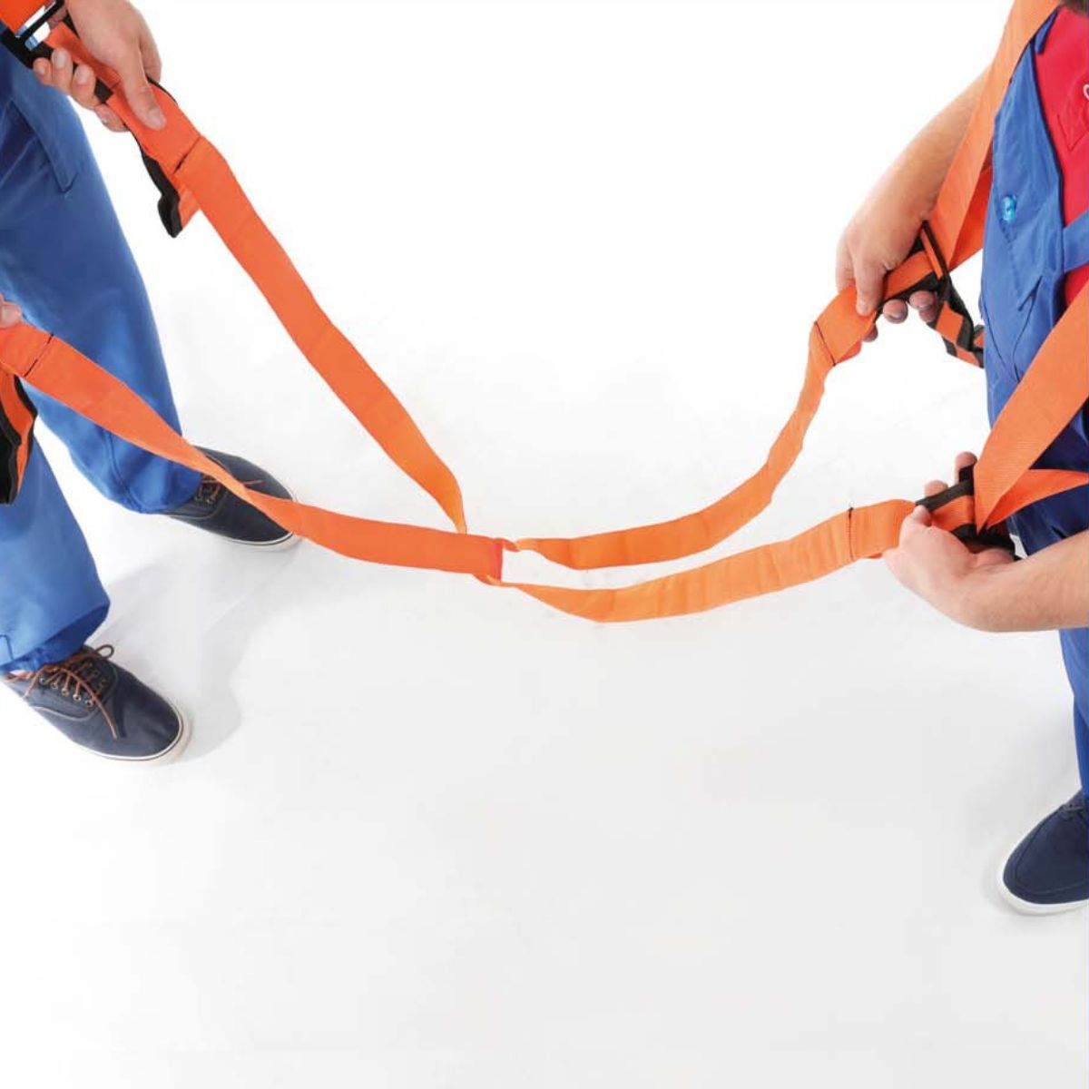 Two people in blue pants and orange harnesses hold onto a rope.