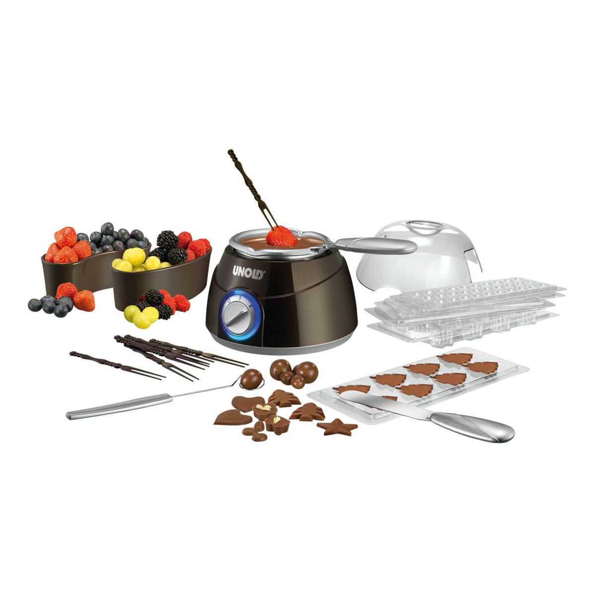 Set per fonduta di cioccolato con bacche, stampi per cioccolato, pentola e forchette.