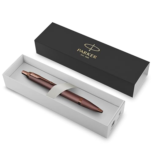 Ein roségoldener Parker-Stift in einer weißen Schachtel mit schwarzem Deckel.