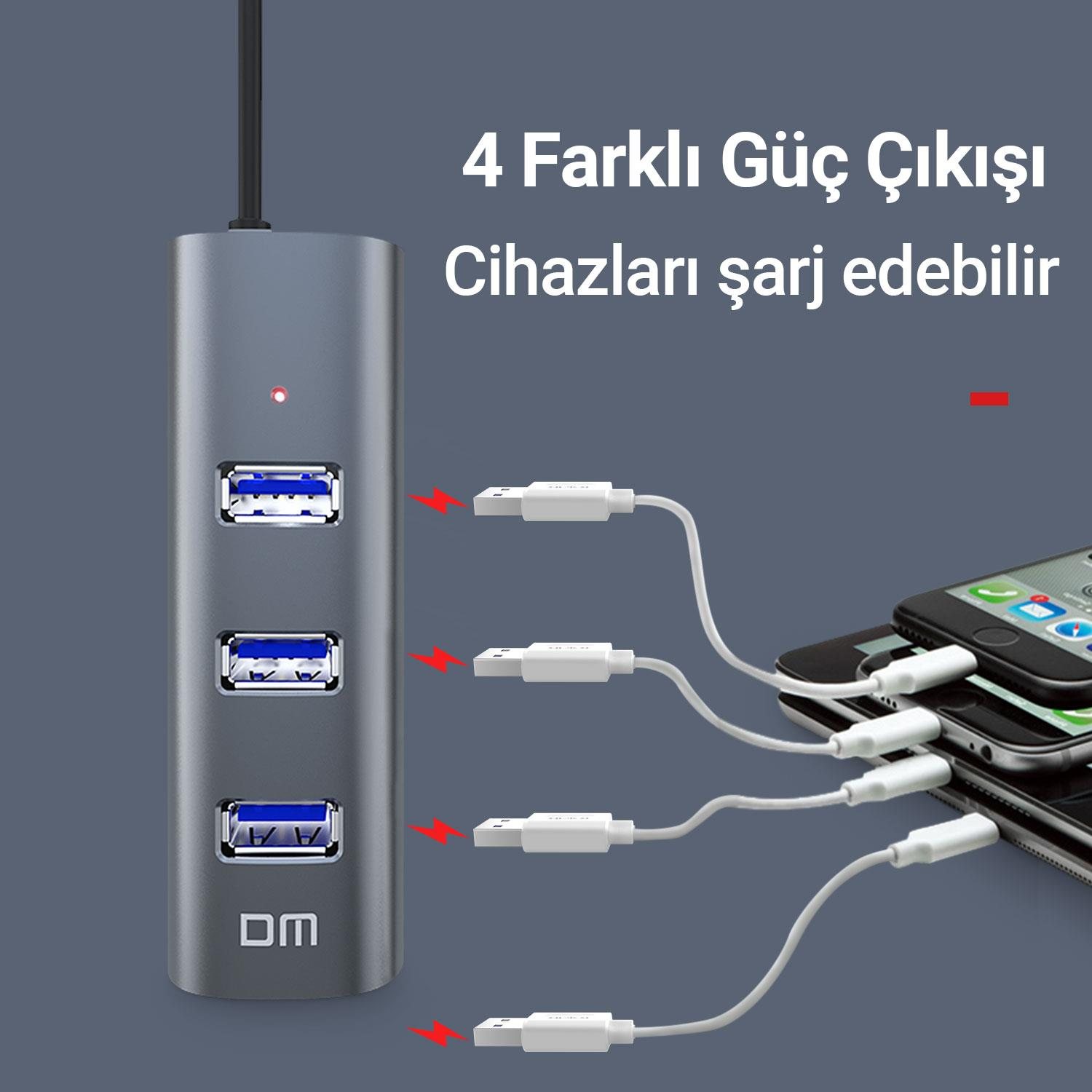 Dört portlu gri USB hub, aynı anda birden fazla telefonu şarj eder.