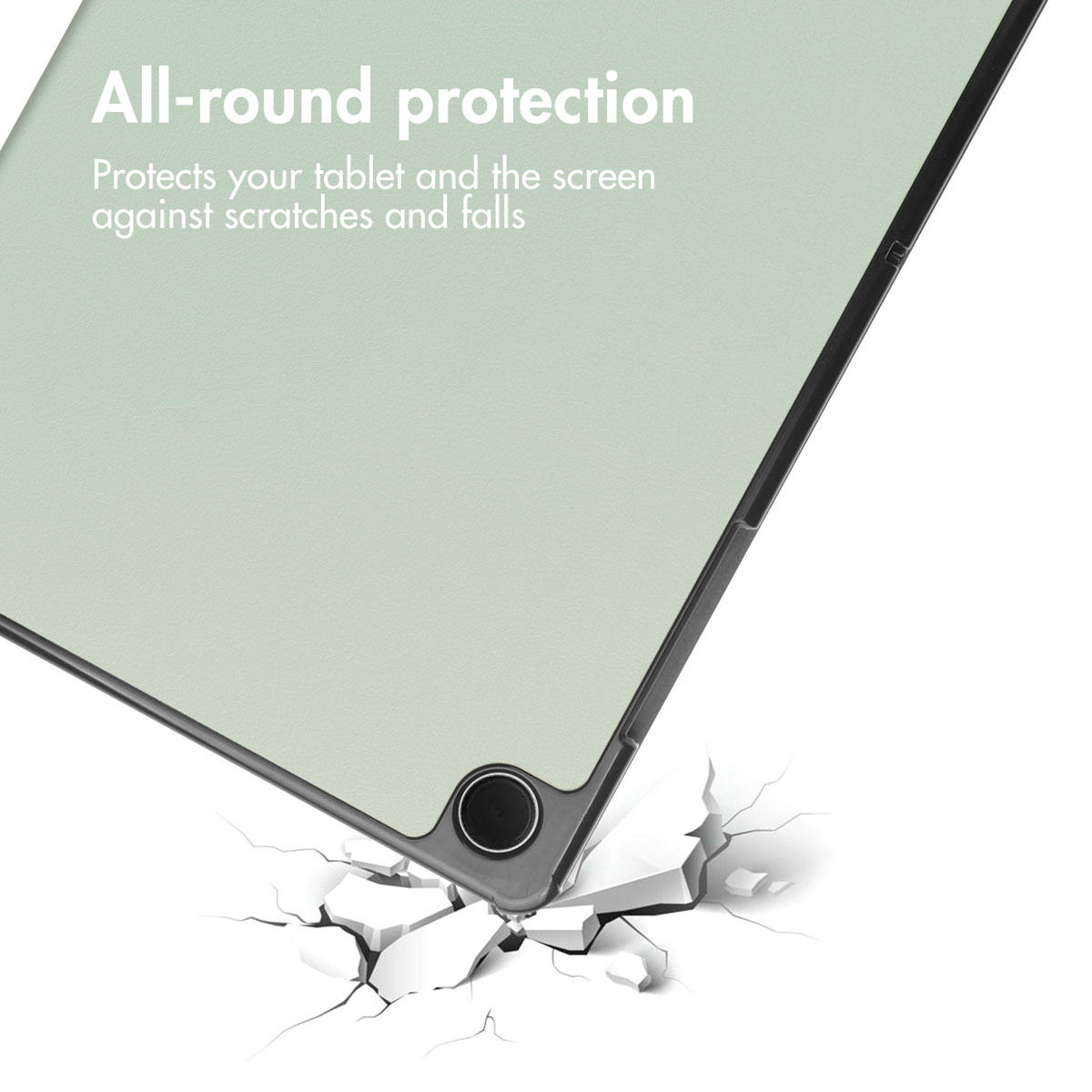 A tablet case with impact protection falling onto cracked ground.