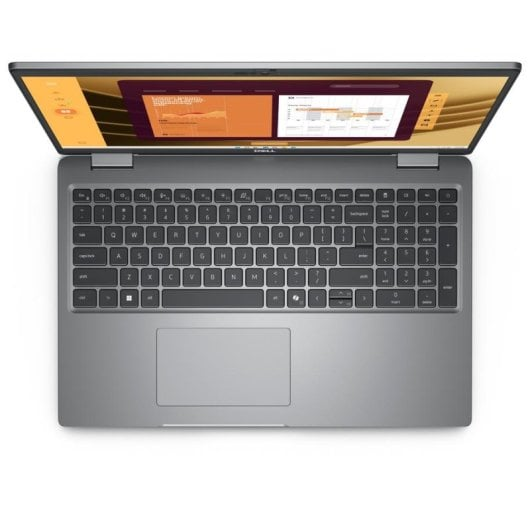 Un portátil Dell plateado abierto que muestra el teclado y el panel táctil.
