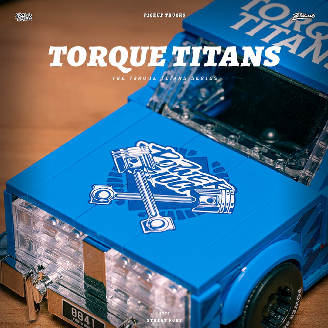 Niebieski pick-up zabawkowa z napisem "Torque Titans" i grafiką tłoka.