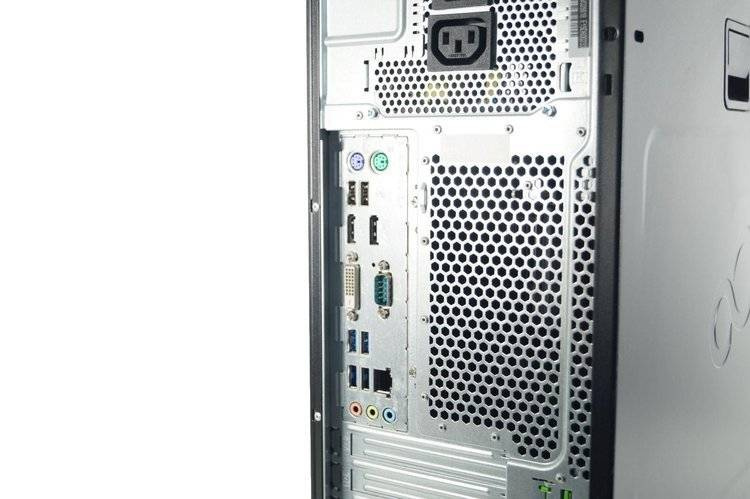 Tył komputera PC z portami USB, DVI i wejściem zasilania.