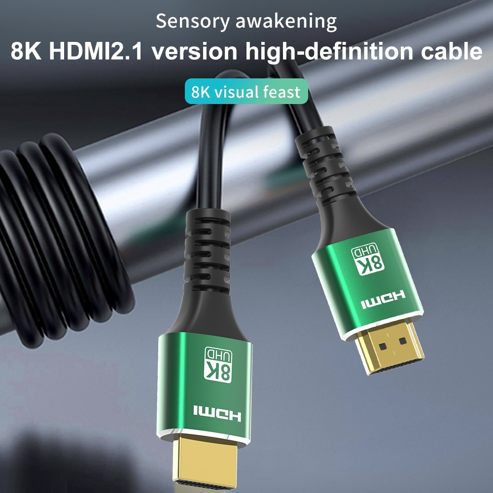 Altın konektörlü iki yeşil 8K HDMI kablosu gri bir zeminde duruyor.