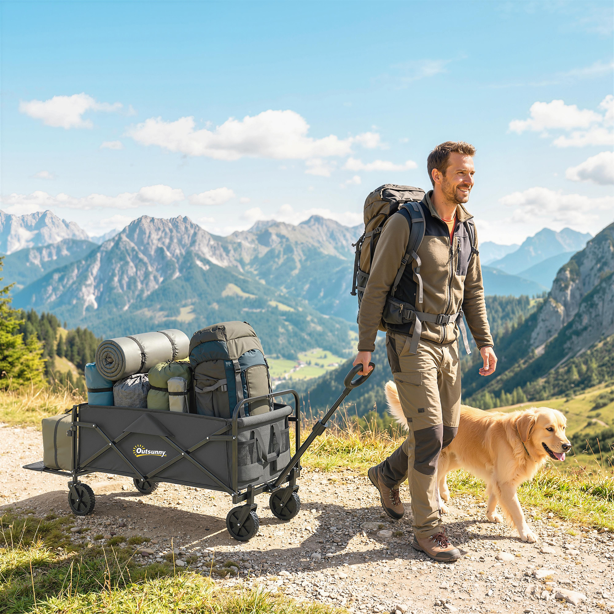 Un uomo con zaino tira un carrello carico con cane in montagna.