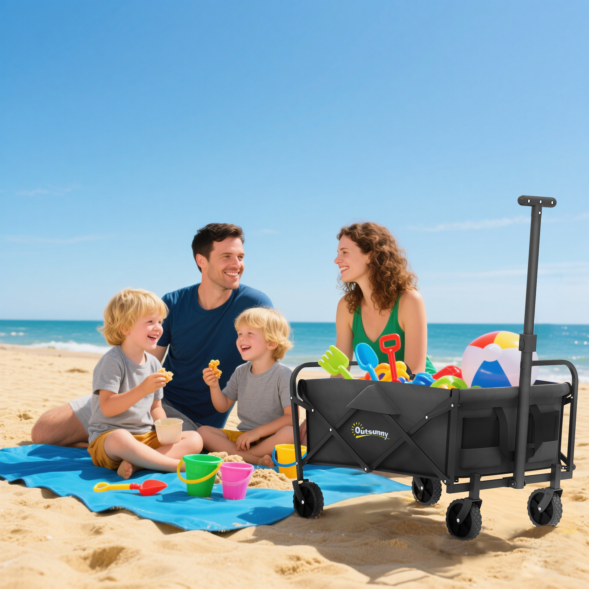 Famiglia che si gode una giornata in spiaggia con giochi di sabbia e un carretto.