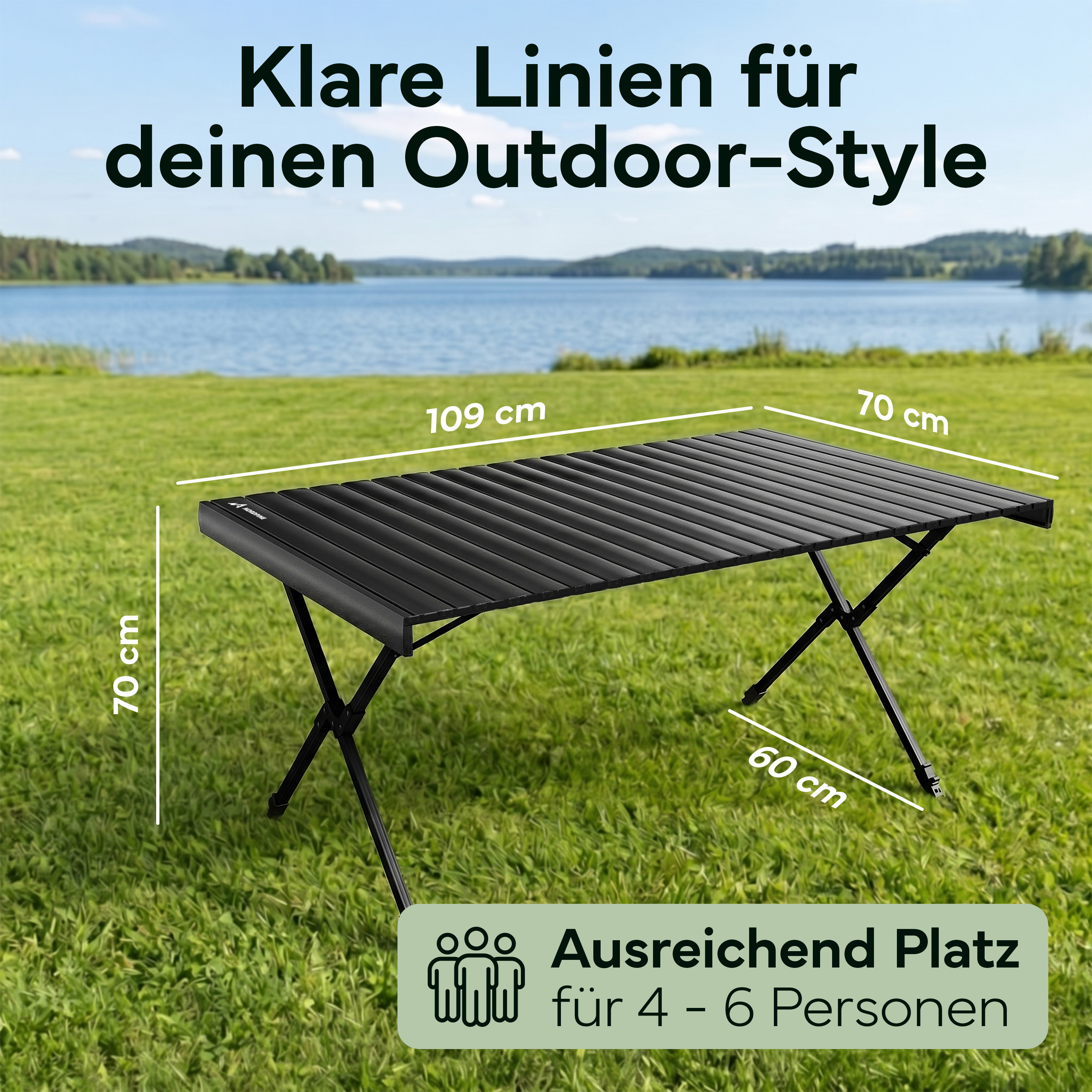 Ein schwarzer Klapptisch mit den Maßen 109x70x60 cm steht auf einer grünen Wiese.