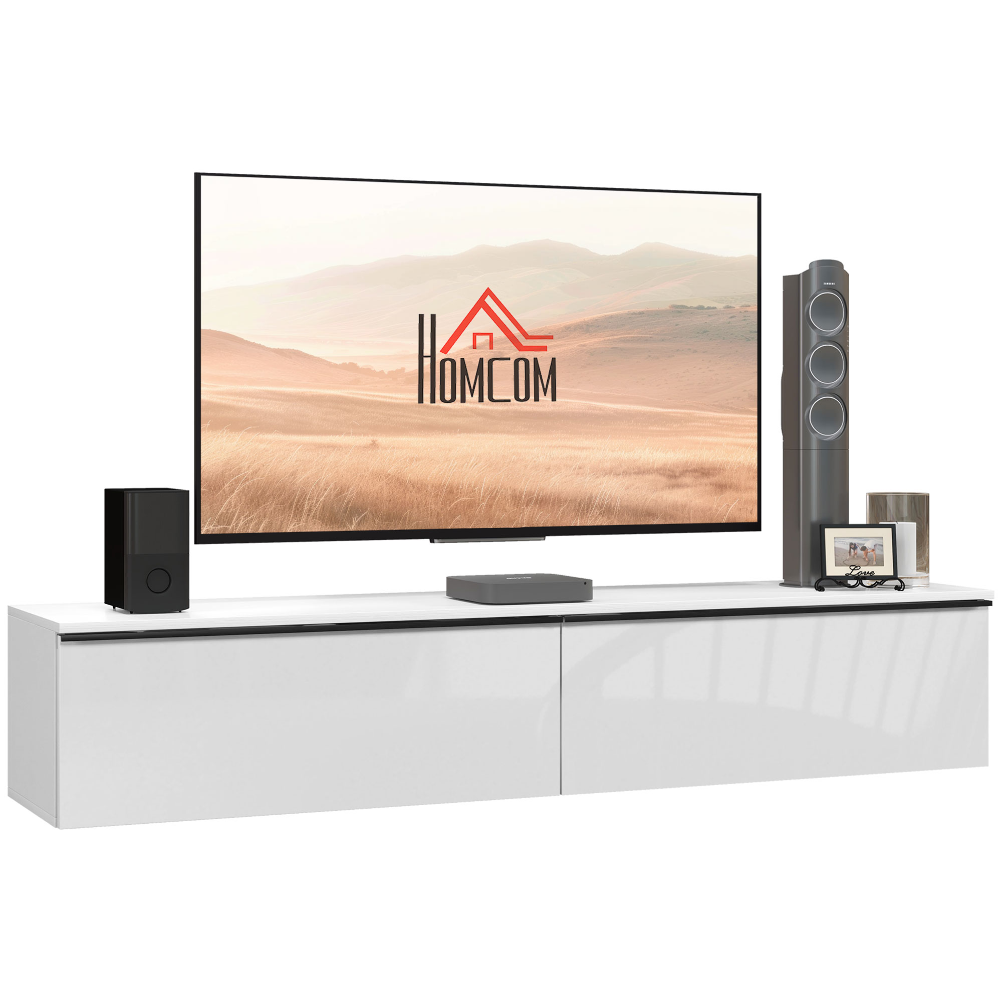 Un mobile TV bianco moderno con un grande televisore, altoparlanti e oggetti decorativi.