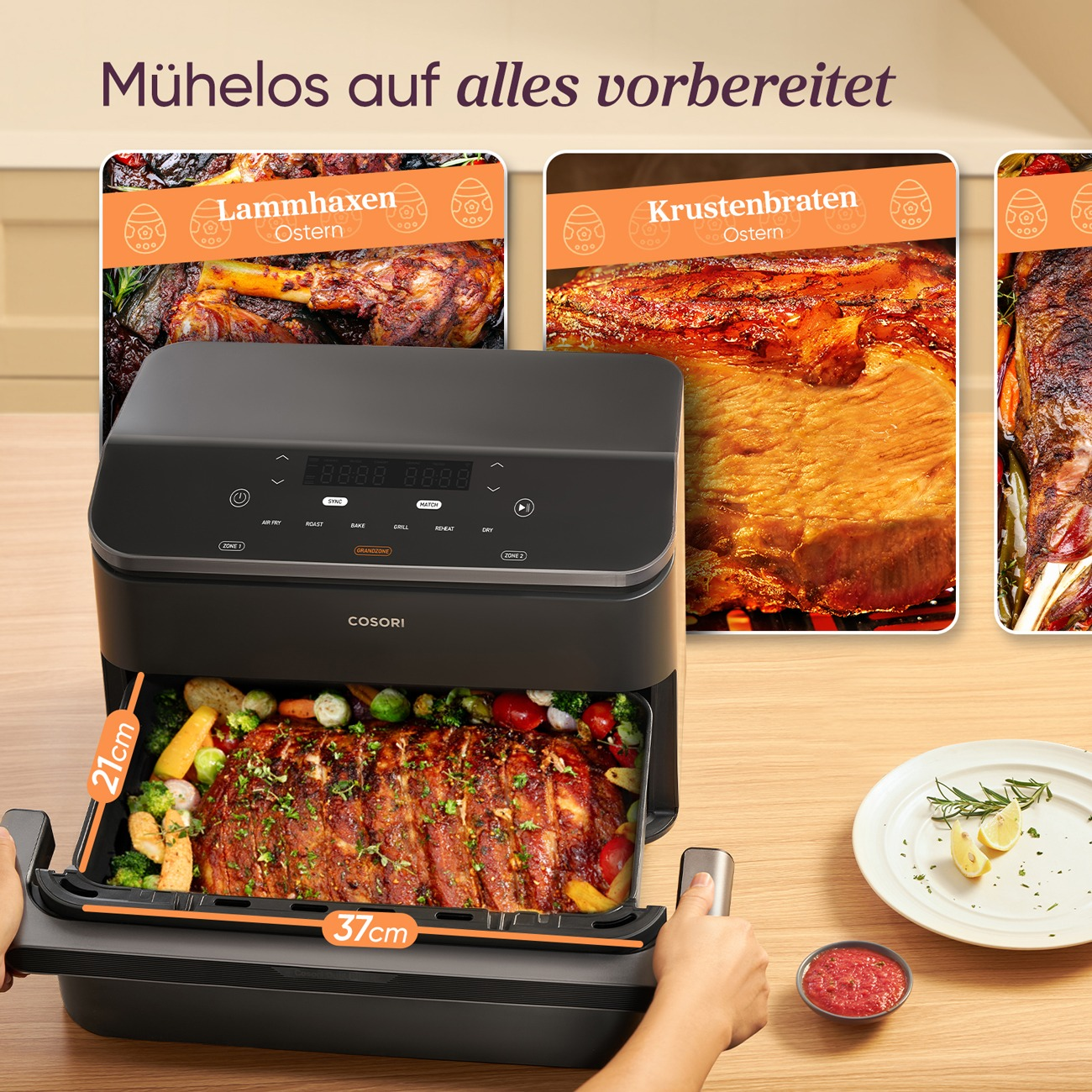 Ein schwarzer COSORI Airfryer mit Fleisch und Gemüse auf dem Tisch.