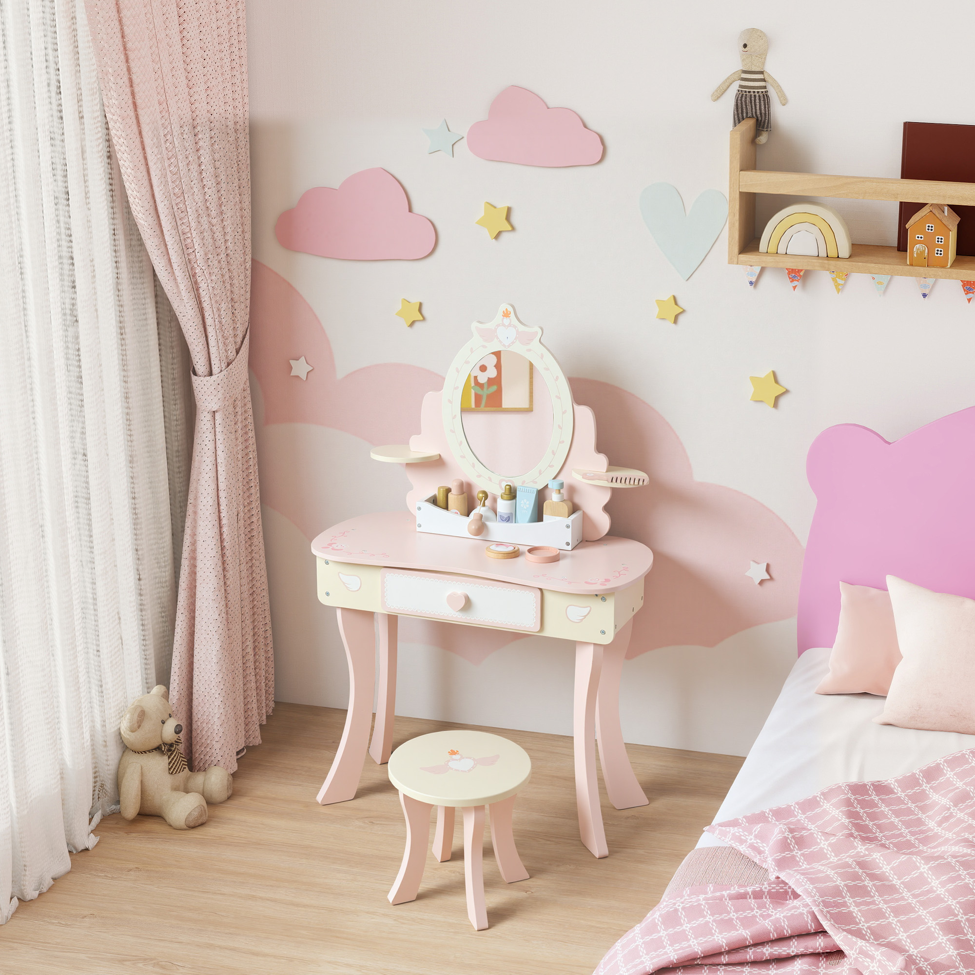 Stanza per bambini con toeletta, specchio, orsacchiotto e letto.