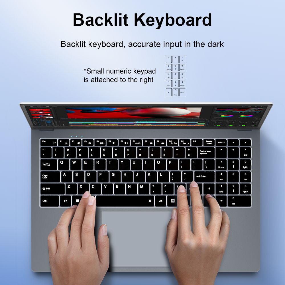 Un portátil con teclado retroiluminado y teclado numérico, manos escribiendo.