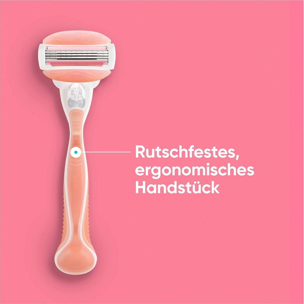 Ein rosafarbener Rasierer mit ergonomischem Griff liegt vor einem pinken Hintergrund.