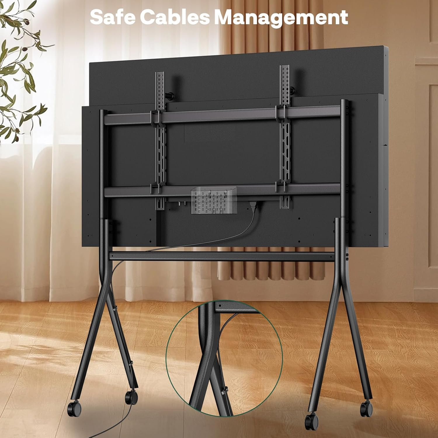 Rückseite eines schwarzen Fernsehers auf einem Rollständer mit Kabelmanagement.
