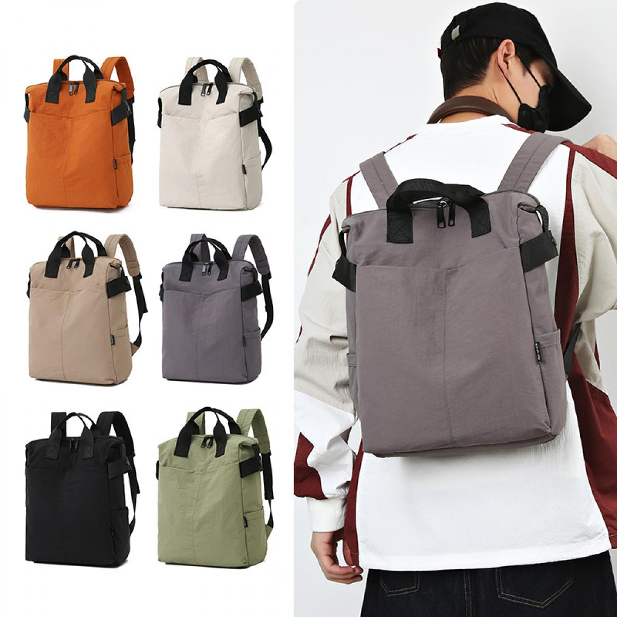 Mehrere Rucksäcke in verschiedenen Farben: Orange, Beige, Grau, Schwarz und Grün.