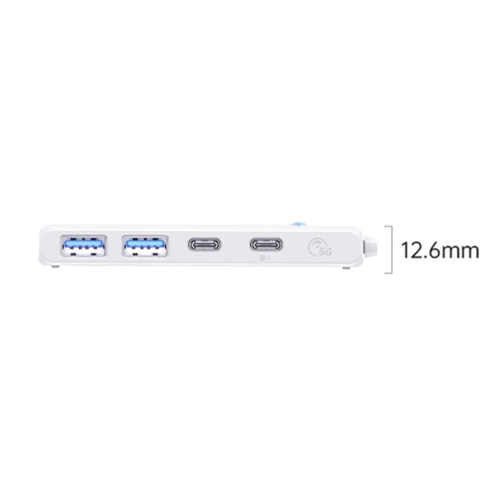 İki mavi USB bağlantı noktası ve iki gri bağlantı noktasına sahip beyaz USB-C hub.