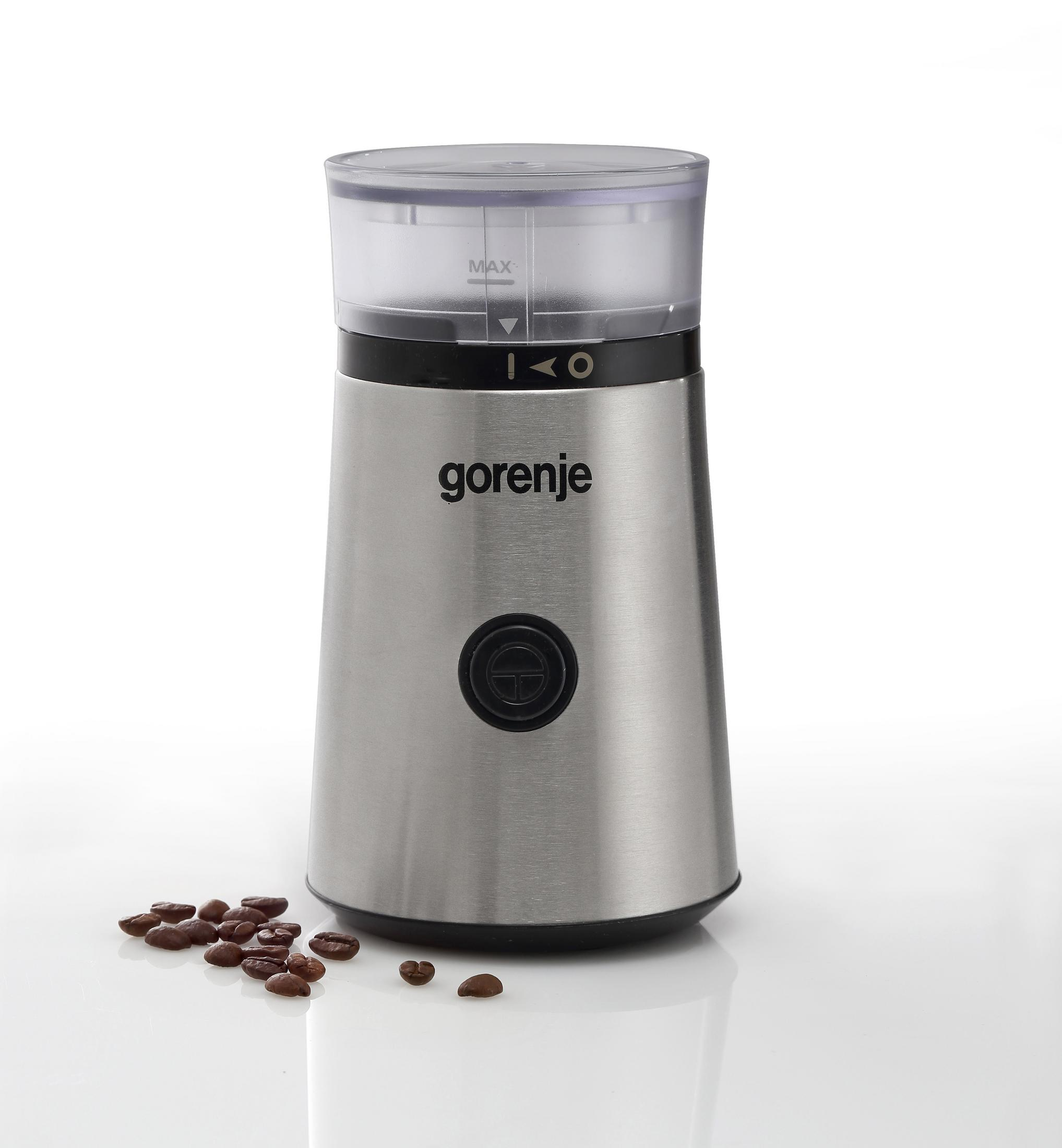 Macinacaffè Gorenje argentato con coperchio trasparente e chicchi di caffè.