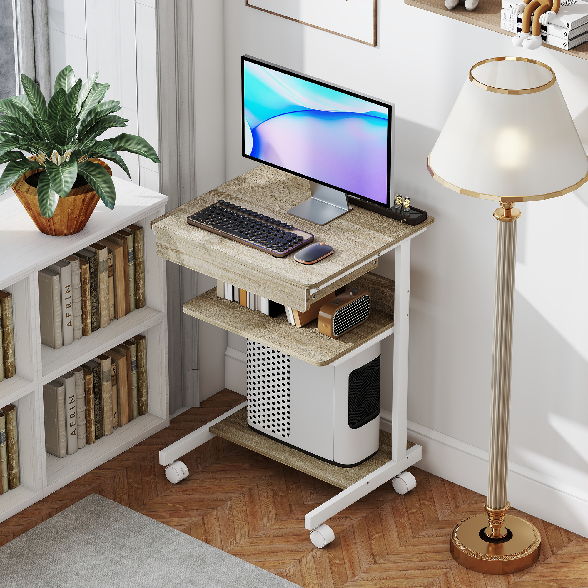 Una scrivania su ruote con computer, tastiera, mouse, radio e libreria.