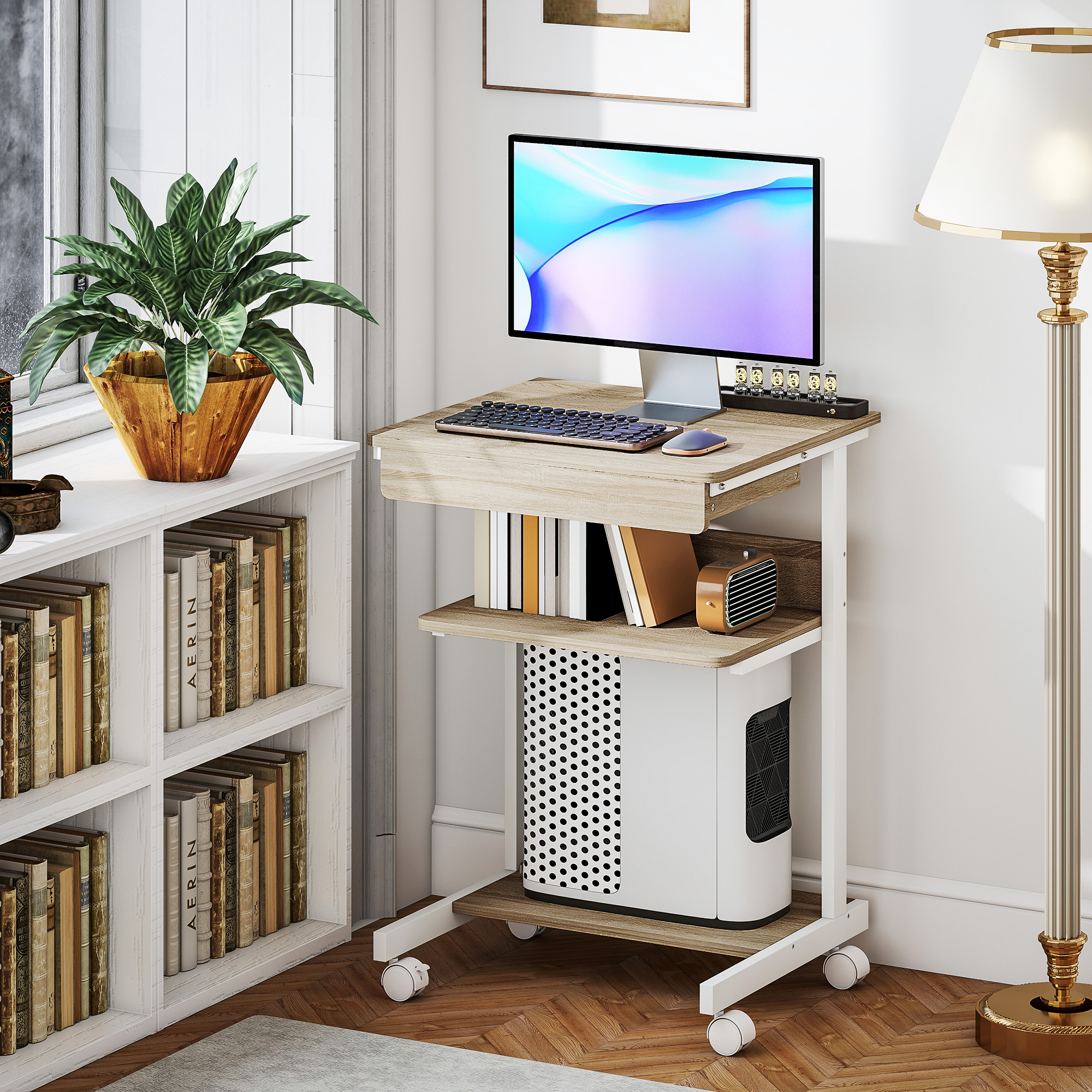Una scrivania per computer su ruote con monitor, tastiera, mouse e case PC.