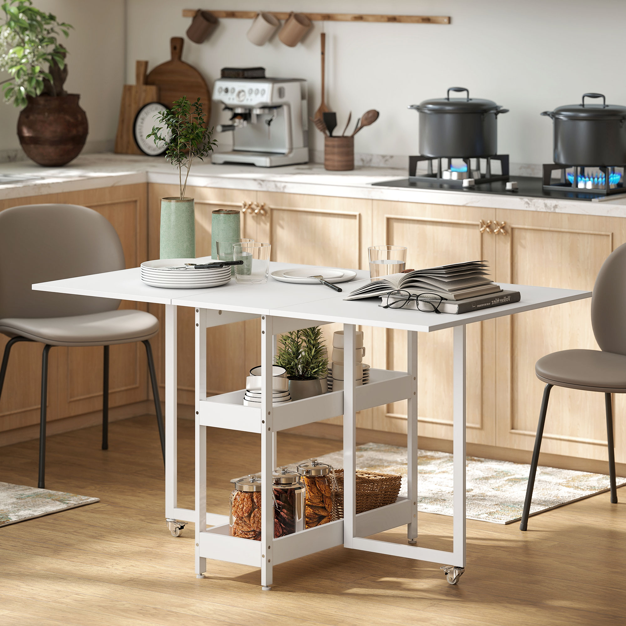 Un set da tavolo da cucina pieghevole bianco con due sedie, libri e piatti.